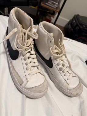 Nike Women's White High-Top Sneakers with Black Swoosh Accent